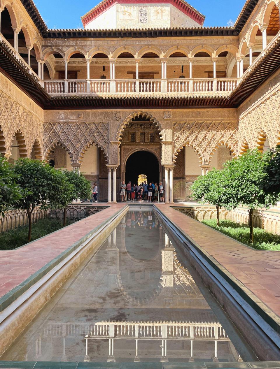 Stunning Moorish architecture in the Real Alcázar of Seville courtyard, Spain.